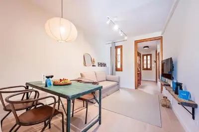 a living room with a table and chairs and a couch at Sweett - Wellington in Barcelona