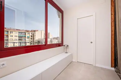 a large window in a white room with a window sill at Sweett - Wellington in Barcelona