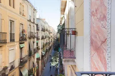 a view of an alley between two buildings at Canela Homes BARCELONA MACBA in Barcelona