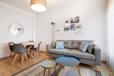 a living room with a couch and a table at Fisa Rentals Aribau in Barcelona
