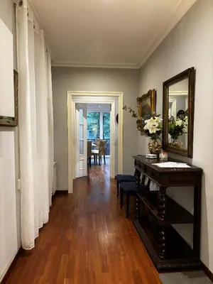 a hallway with a table and a mirror at Gracia Apartment in Barcelona