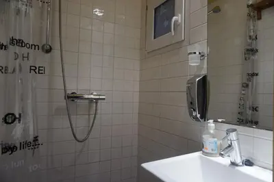 a bathroom with a shower and a sink at ApartEasy - Montjuïc & Fira in Barcelona