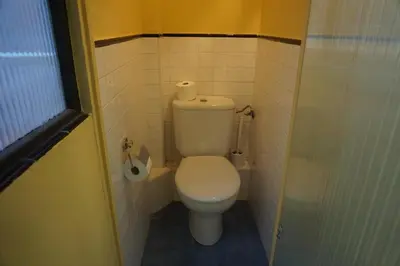 a small bathroom with a toilet in a stall at ApartEasy - Montjuïc & Fira in Barcelona