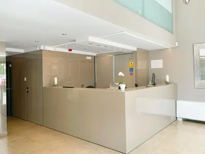 a lobby with a reception desk in a building at SM Hotel Teatre Auditori in Barcelona