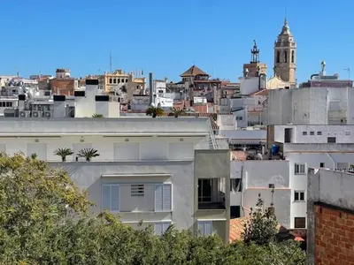 a view of a city with buildings at Unique studio Apartment with amazing terrace Sitges centre beach in Sitges