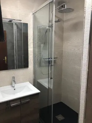 a bathroom with a shower and a sink at 3 bedroom Apartment with private garden on top location Sitges centre beach in Sitges