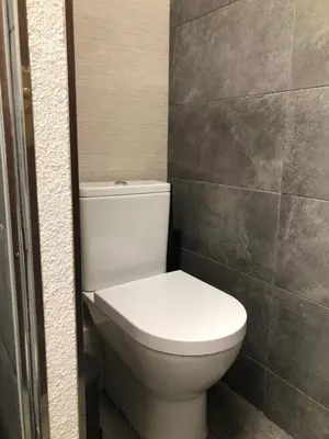 a bathroom with a white toilet in a room at 3 bedroom Apartment with private garden on top location Sitges centre beach in Sitges