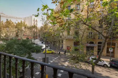 a view of a city street with cars and buildings at ApartEasy - Sant Antoni Market in Barcelona