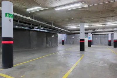 an empty parking lot with columns in a parking garage at Casa Lit Barcelona in Barcelona