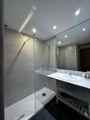a bathroom with a glass shower and a sink at Barcelona4Seasons - Central Palace in Barcelona
