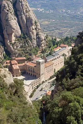 a large building on the side of a mountain at Xalet de la Muntanya, El Bruc-Montserrat in El Bruc