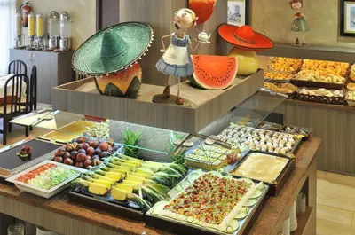 a buffet with many different types of food on display at Hotel President in Calella