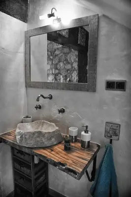a bathroom with a sink and a mirror at Cova Safaja in San Quírico Safaja