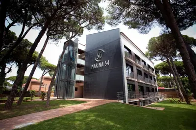 a building with a sign on the side of it at SG Marina 54 Apartments in Castelldefels