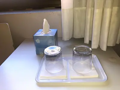 a tray with two candles and a box of tissues at Hostal Sant Pau in Barcelona