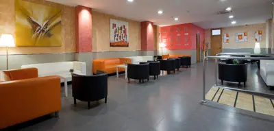 a dining room with chairs and tables in a restaurant at Hostal Barcelona in Barcelona
