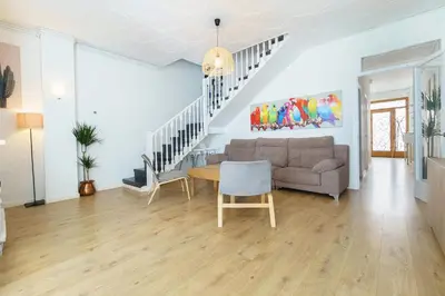 a living room with a couch and a table at Casa Premia in Premiá de Mar