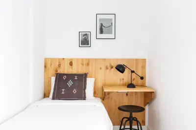 a bedroom with a bed and a desk at WOW Apartments by Olala Homes in Hospitalet de Llobregat