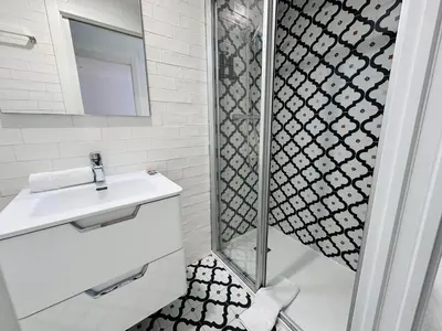 a bathroom with a shower and a sink at Rainbow Apartments BY BLAUSITGES in Sitges