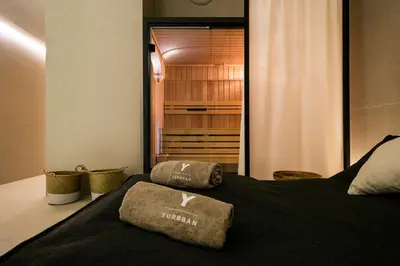 a bedroom with a bed with two pillows on it at Yurbban Passage Hotel & Spa in Barcelona