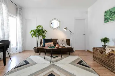 a living room with a couch and a table at Centric Apartments Paseo de Gracia in Barcelona