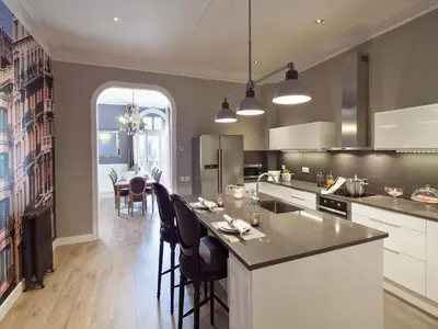 a kitchen with a island with chairs and a table at Exclusive apartment for 4 people in characteristic area of Barcelona in Barcelona