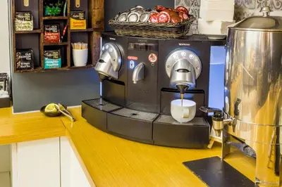 a coffee maker is sitting on a counter at Apart-Suites Hostemplo in Barcelona