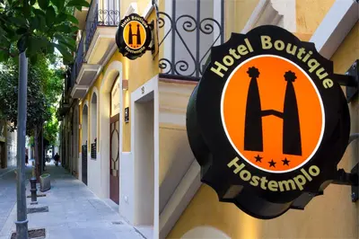 a sign on the side of a building at Apart-Suites Hostemplo in Barcelona