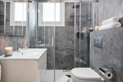a bathroom with a shower and a toilet and a sink at Sitges Group Calm Beach in Sitges