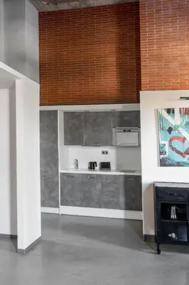 a kitchen with a stove top oven in a room at Barcelona Apartment Republica in Barcelona