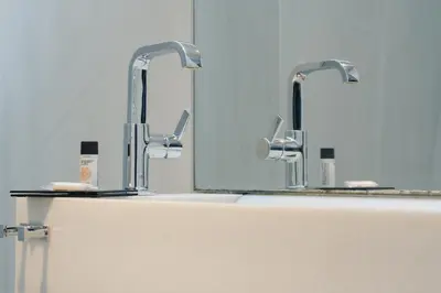 a bathroom with two sinks and two mirrors at Cosmopolitan Boutique Rambla in Barcelona