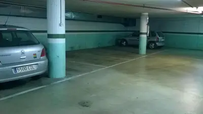 two cars parked in an underground parking garage at Hotel Montmeló in Montmeló