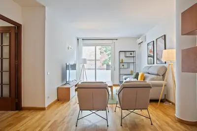 a living room with a couch and two chairs at Alcam El Coll in Barcelona