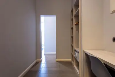 a hallway with a door leading into a room at Plaza Goya Rooms in Barcelona