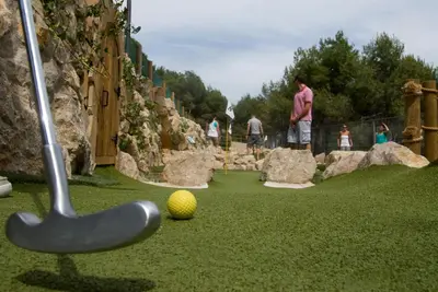 a miniature golf course with a ball and a stick at Camping Vilanova Park in Vilanova i la Geltrú