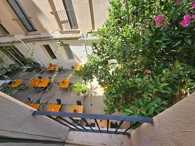an overhead view of a patio with tables and chairs at Hotel Palermo in Barcelona