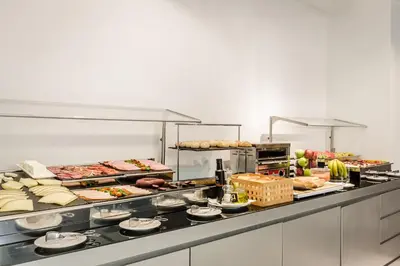 a kitchen with a bunch of food on a counter at Ikonik Lex in Hospitalet de Llobregat