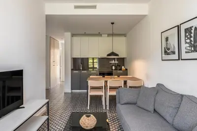 a living room with a couch and a table at Aspasios Poble Nou Apartments in Barcelona