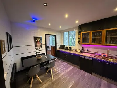 a large kitchen with a table and chairs in it at Les Canyes Cottage, Private Villa Resort in Piera
