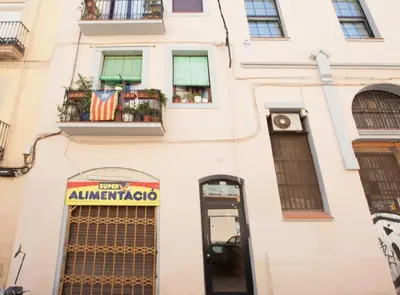 a building with a sign that reads albuquerque at Pere IV · New & modern apartment close to beach in Barcelona