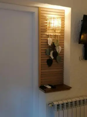 a room with a window with a plant on the wall at Cal Músic B&B in Premia de Dalt