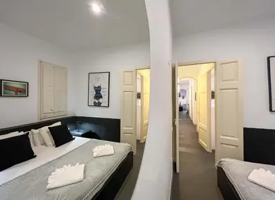 a bedroom with two beds and a hallway at Stay Unique Apartments Cent in Barcelona
