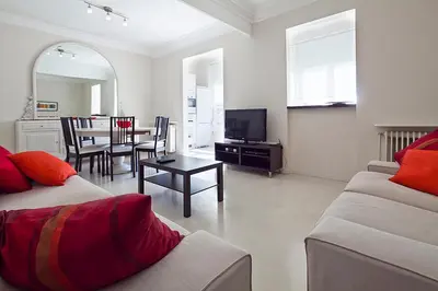 a living room with a couch and a table at Central and Spacious Family Apartment in Barcelona