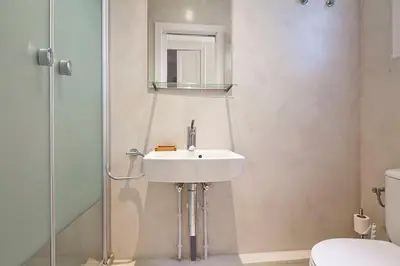 a bathroom with a sink and a shower at Central and Spacious Family Apartment in Barcelona