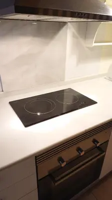 a counter top with a stove in a kitchen at Cal Ton M in Castelltersol