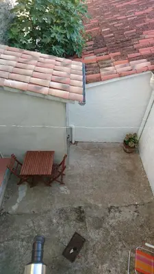 a bench sitting in front of a building at Cal Ton M in Castelltersol