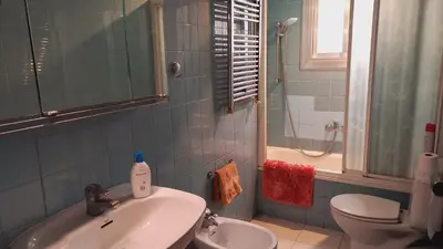 a bathroom with a sink and a toilet and a shower at Plaza Universitat in Barcelona