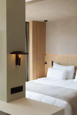 a bedroom with a large bed with white pillows at Hotel Arconte, Adults Only in Barcelona