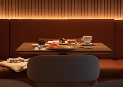 a table with a plate of food and a cup of coffee at Hotel Arconte, Adults Only in Barcelona
