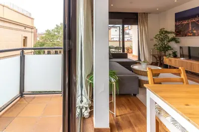 two views of a living room and a balcony at Céntrico apartamento con terraza in Barcelona